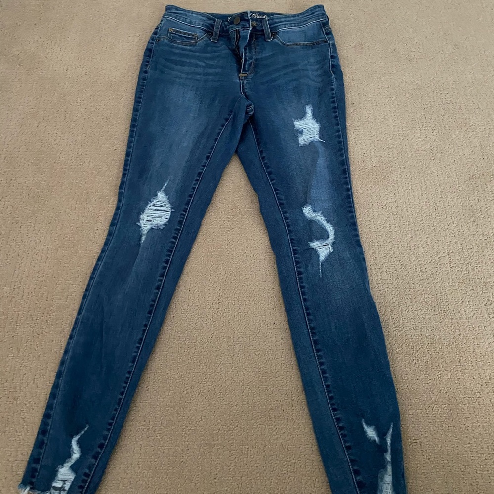 Ripped, medium washed denim jeans